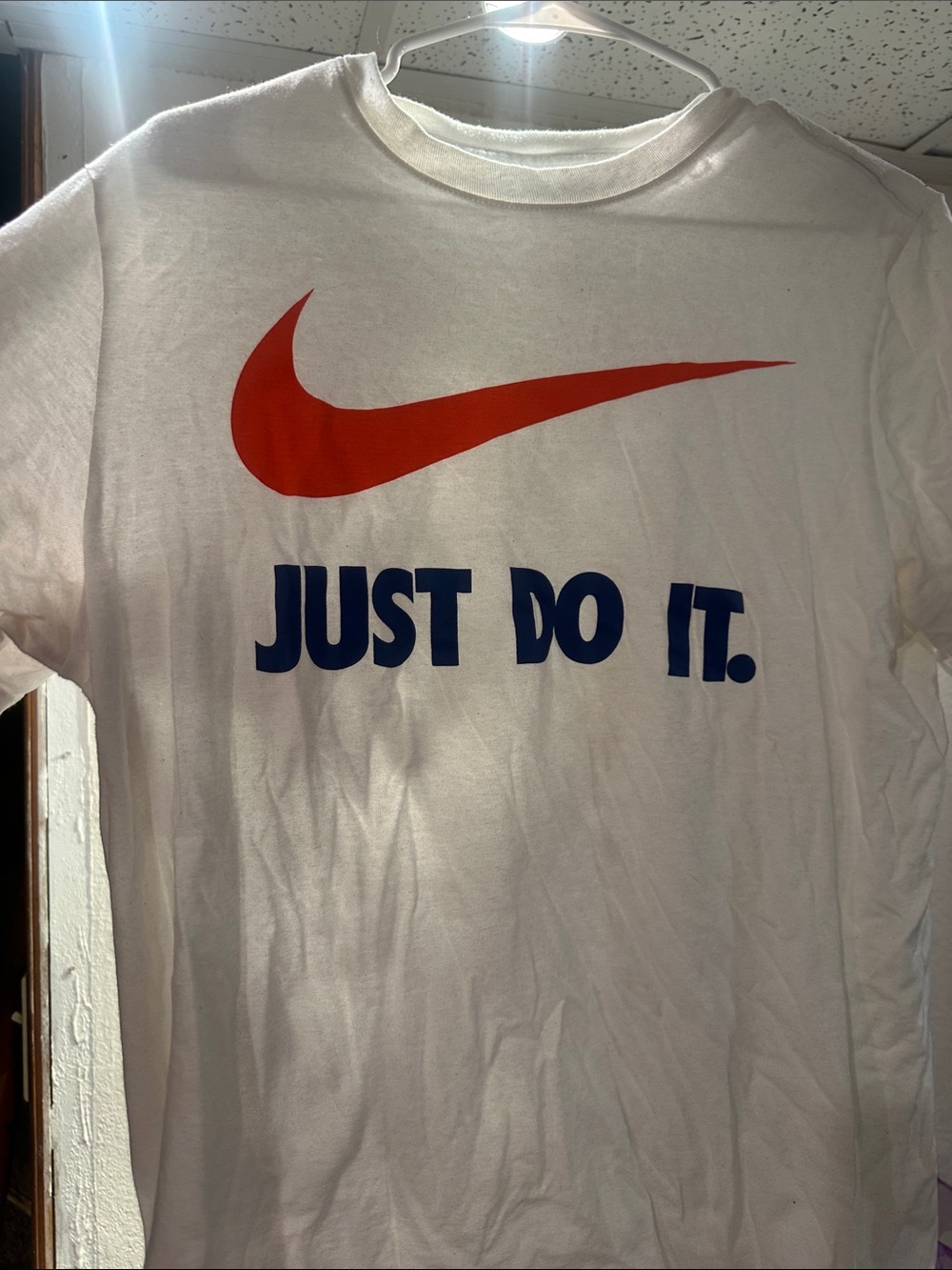 Nike White Tee with Red Swoosh and Blue Text